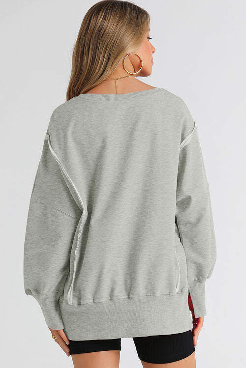 Exposed Seam Long Sleeve Slit Sweatshirt